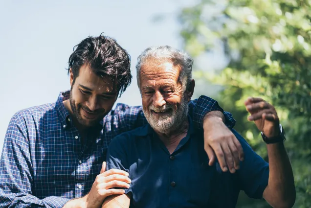 young and old man enjoying the garden 